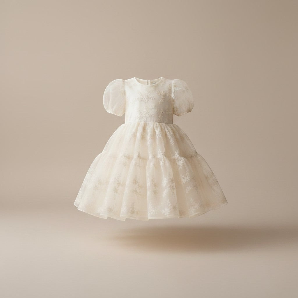 Julie Dausell off-white tulle dress with puff sleeves and delicate floral embroidery for special occasions.